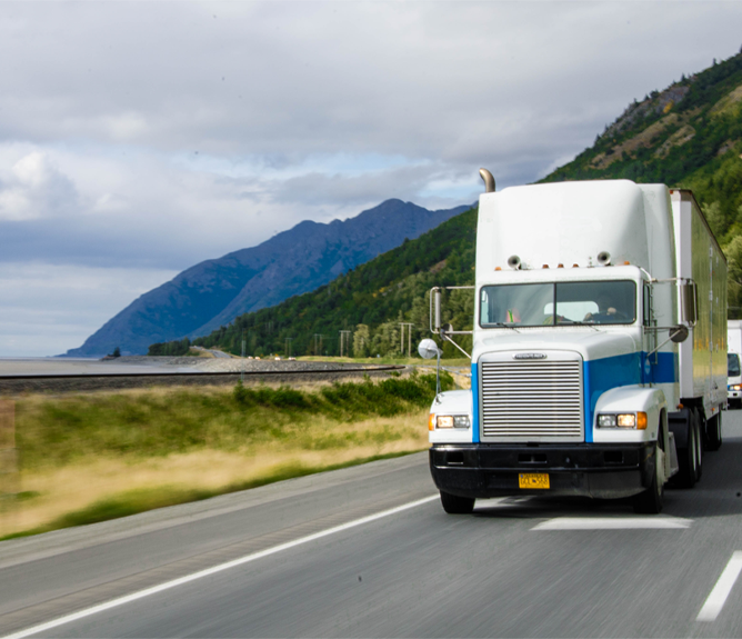 freight-truck-traveling-road-is-left royal alaskan truck on road