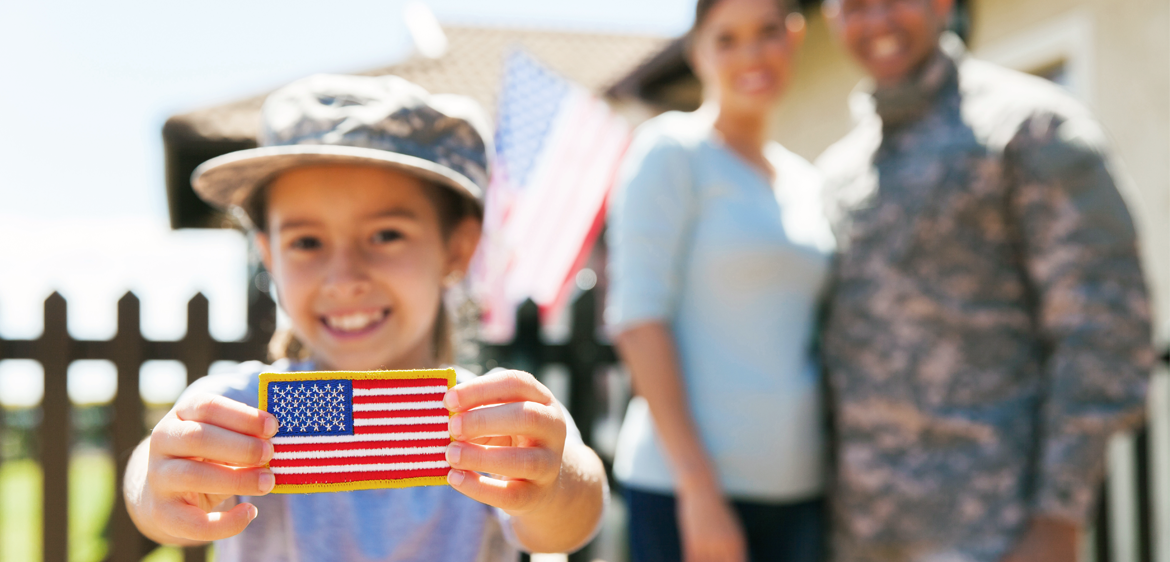 little girl smiling with us flag patch