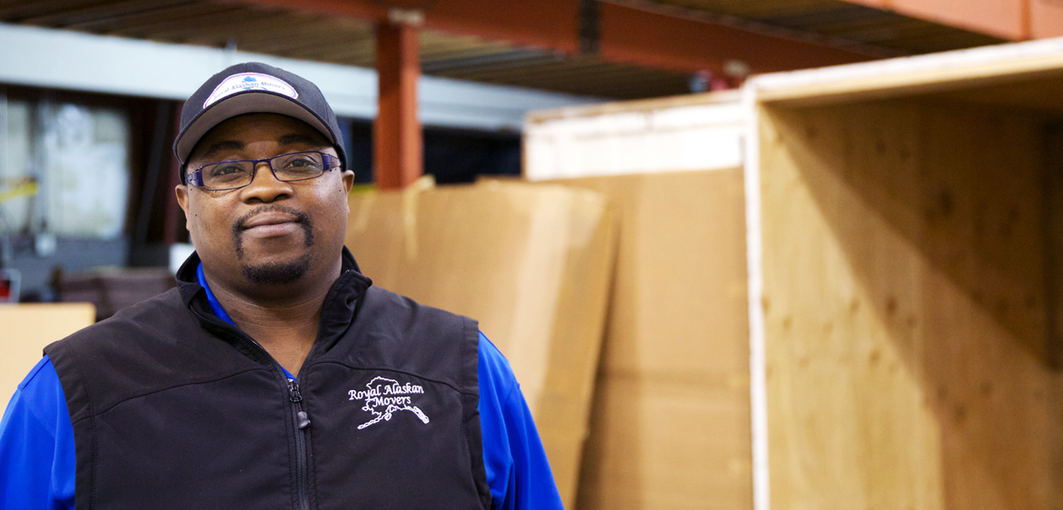 manager smiling in warehouse