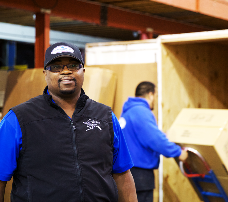 manager-smiling-warehouse-worker-back-cs-right employees in warehouse in anchorage