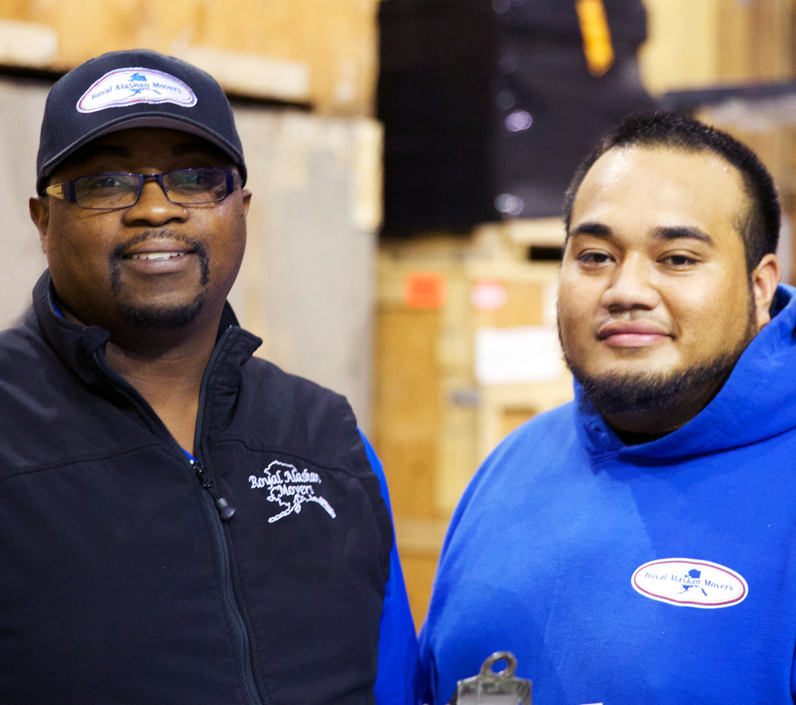 employees in warehouse smiling