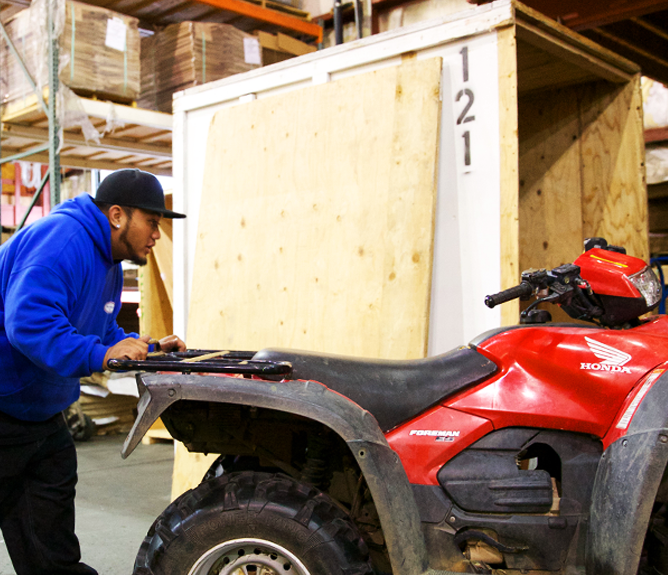 moving-atv-warehouse-2-is-left employee moving atv