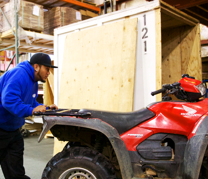 employee moving atv