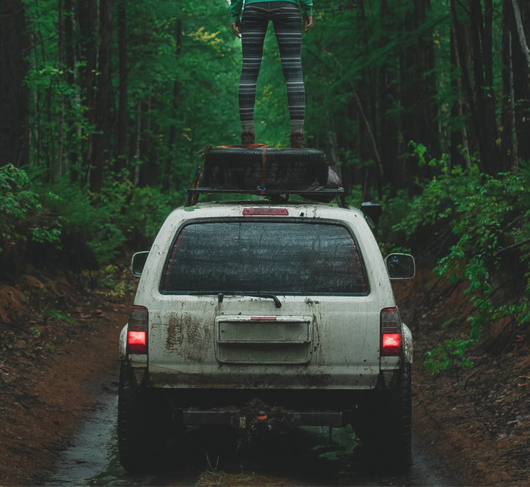 muddy-suv-in-woods-is-right suv in alaskan woods