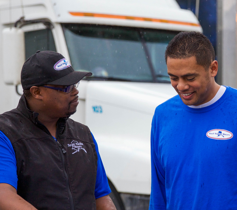two-men-talking-rain-cs-right employees talking outside in yard