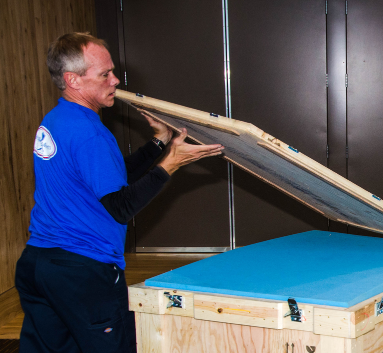 worker-opening-crate-installation-is-right ram worker opening cratee