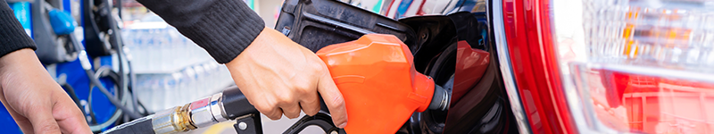 01 10 22 Gas Refuel cars at the fuel pump. The driver hands, refuel and pump the car's gasoline with fuel at the petrol station. Car refueling at a gas station Gas station