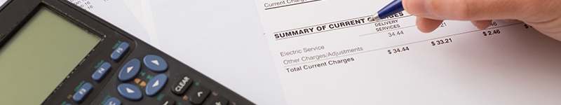01 10 22 Utilities Electric bill charges paper form on the table