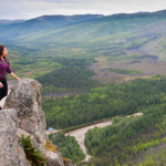 12 12 22 Guide to the North Pole 6 Woman overlooking a trail at the Chena River State Recreation Area