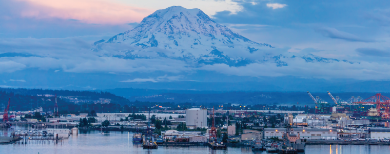 A view of Mount Rainier and the Port of Tacoma at twilight.